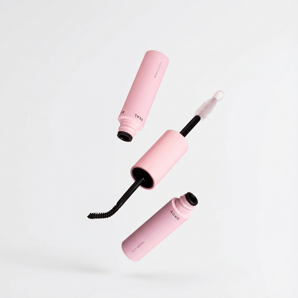 Woman applying DIY lash clusters at home using Lash Ease starter kit